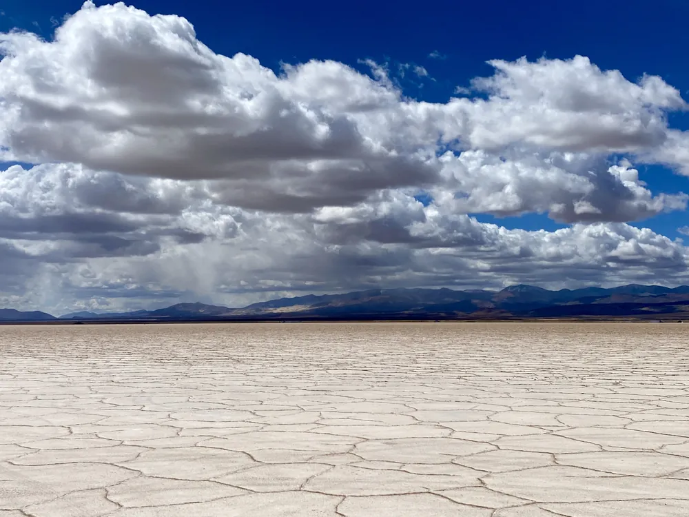 Salt flats beneath gathering storm clouds at Salinas Grandes, Argentina